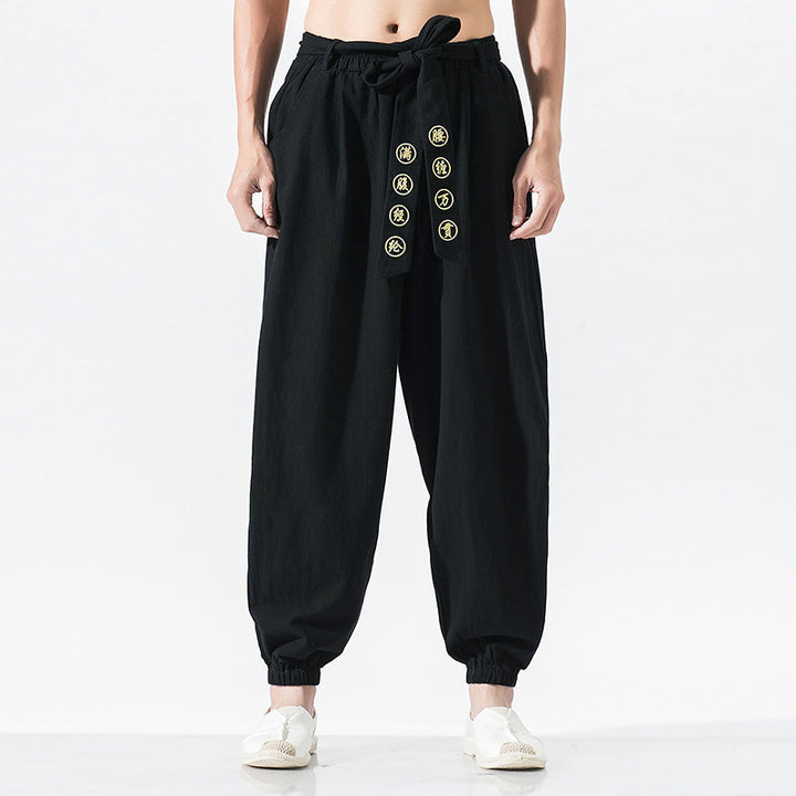 Women's wide linen trousers with drawstring waistband, binding detail, and elastic ankle cuffs Mune Fashion