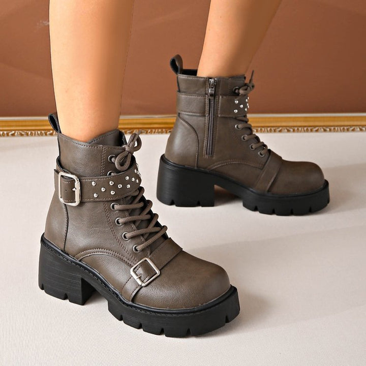 Women's rugged lace-up biker boots with decorative studded straps, side zipper, and textured platform sole Mune Fashion