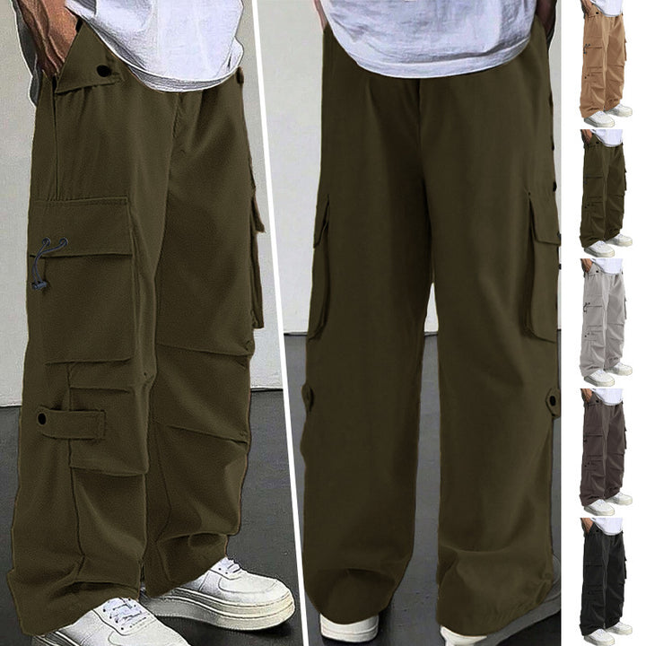 Men's baggy cargo pants with utilitarian flap pockets, drawstring waistband, and reinforced seams Mune Fashion