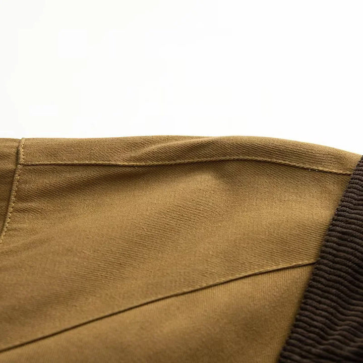 Women's oversized cape coat with corduroy collar, toggle closures, and large patch flap pockets Mune Fashion