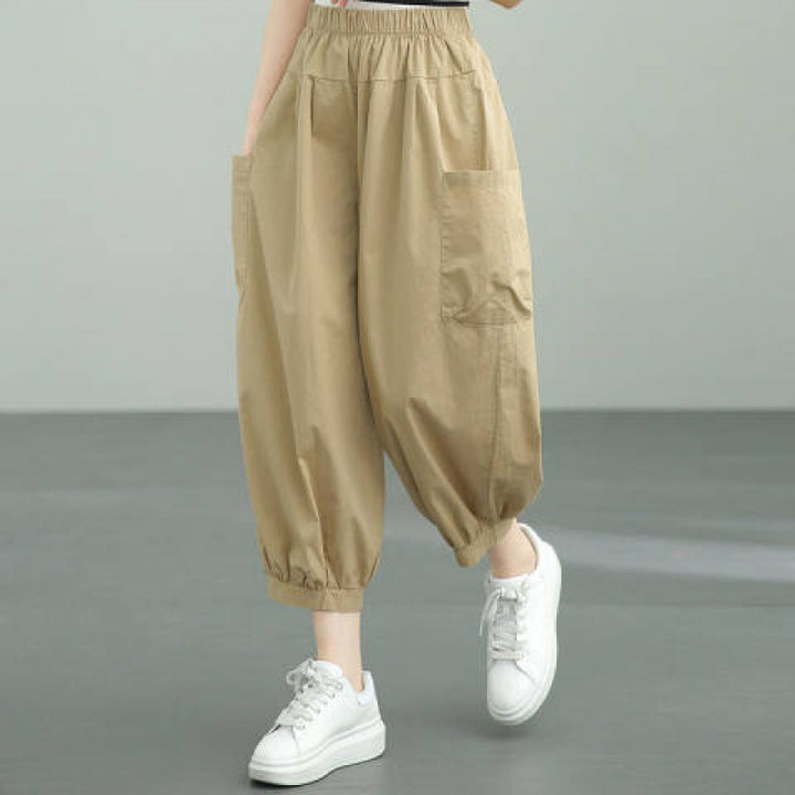 Women's wide harem pants with elastic waistband and applied side pockets Mune Fashion