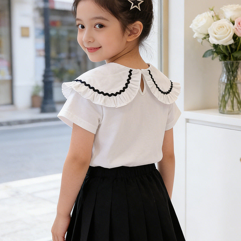 Girl's blouse with ruffled hem and floral design Mune Fashion