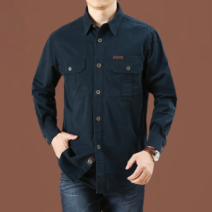 Men's robust cotton twill field shirt with patch flap chest pockets and distinctive seam details.