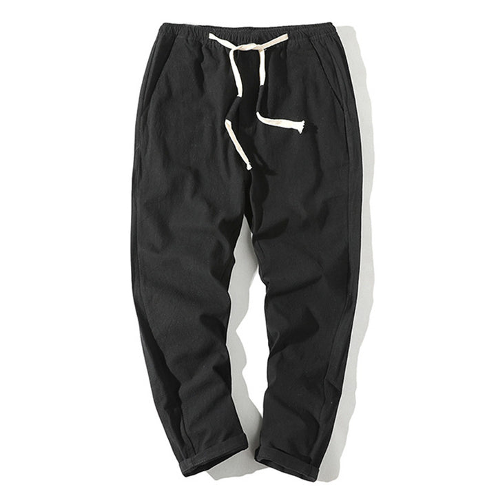 Men's lightweight linen trousers with elastic waistband and drawstring, tapered fit and roll-up hem Mune Fashion