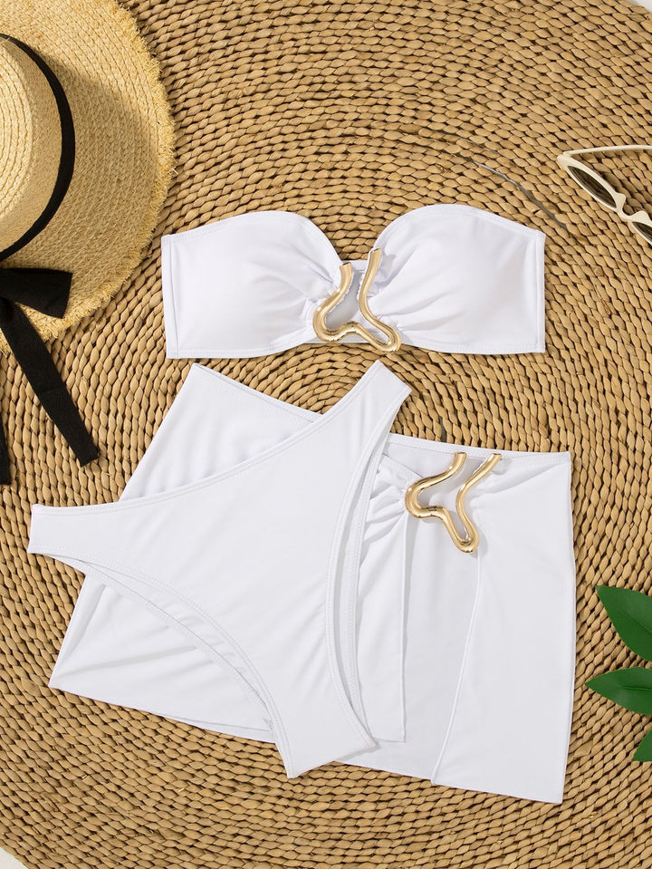 Women's bandeau bikini set with stylish skirt detail and golden accents Mune Fashion
