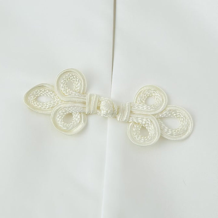 Women's short jacket with stand collar and decorative knot closures Mune Fashion