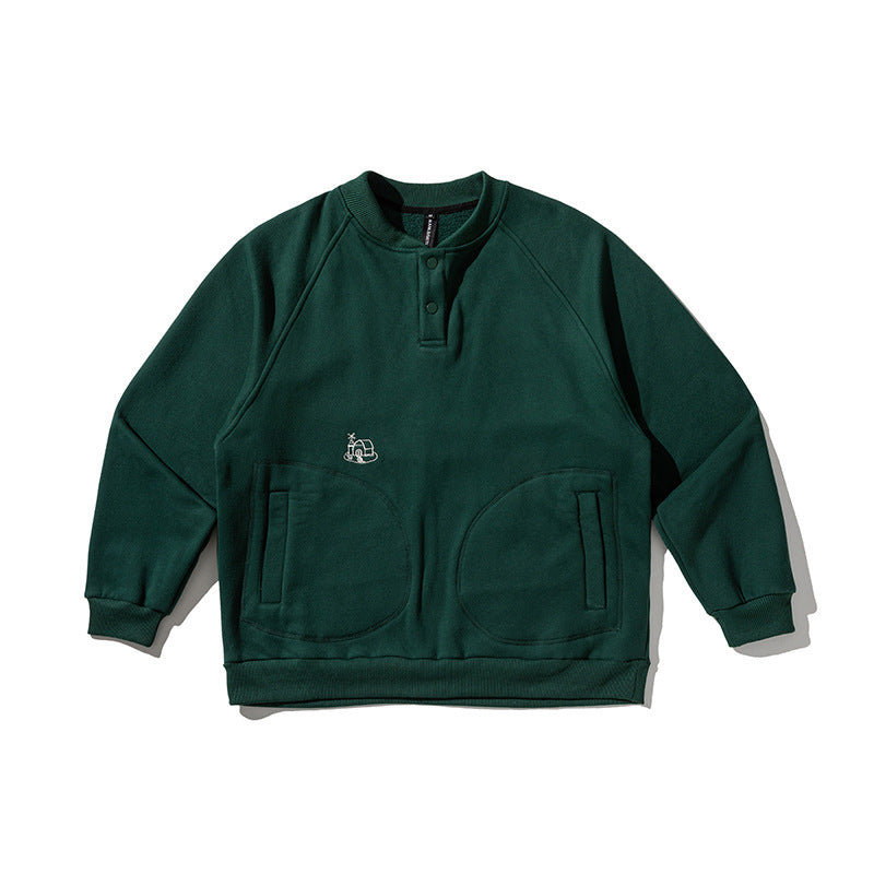 Unisex Oversize Henley Sweatshirt with raglan sleeves, button placket, and distinctive round pockets Mune Fashion