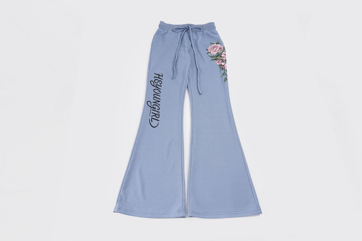 Women's casual jersey sweatpants with drawstring, floral side print, and statement lettering Mune Fashion