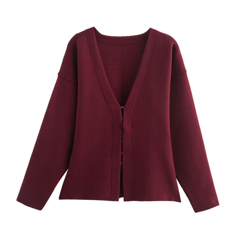 Women loosely fitted fine knit cardigan with deep V-neck and concealed button placket Mune Fashion