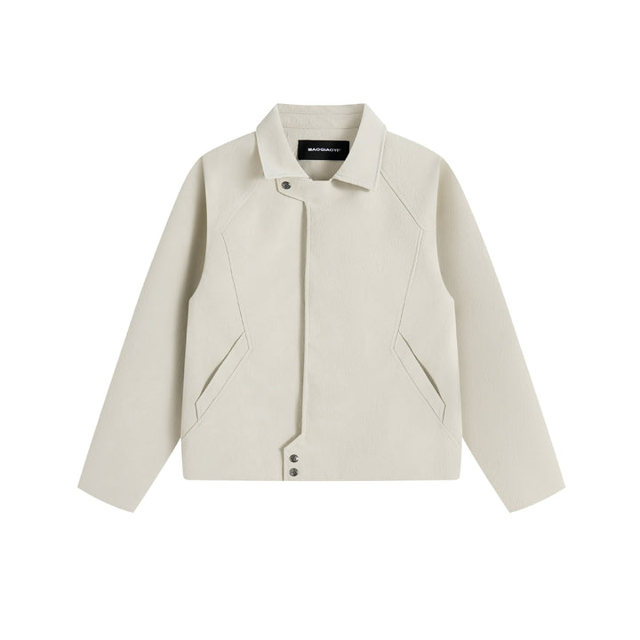 Men's short jacket in suede look with asymmetric front flap and geometric flap pockets.