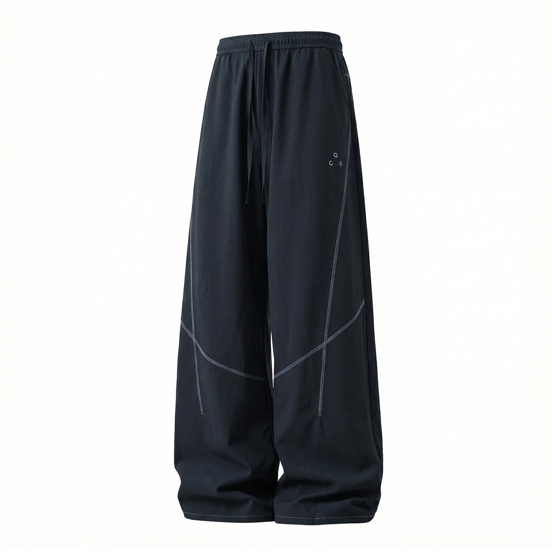 Unisex Extra wide training pants in palazzo cut with drawstring and striking decorative seams Mune Fashion
