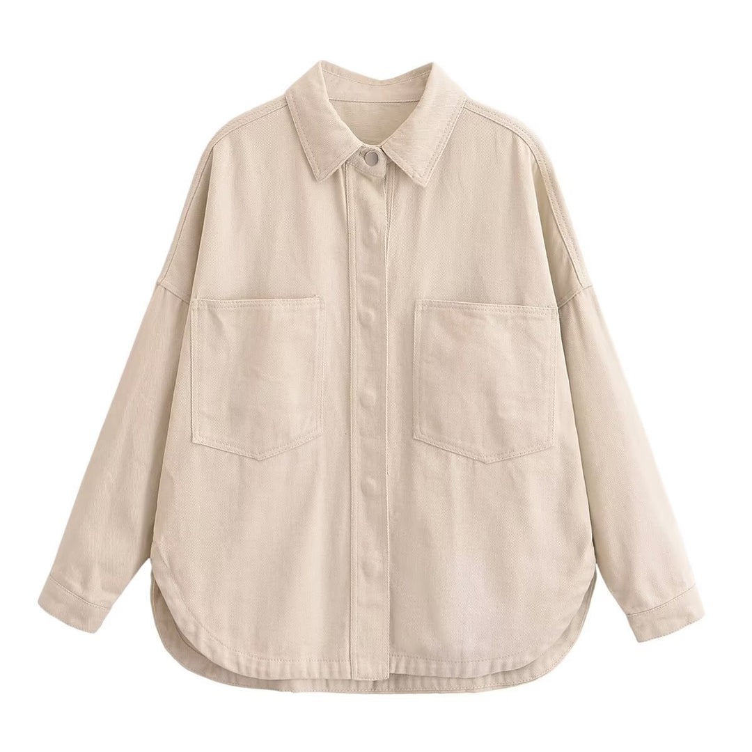Women's oversized denim shirt with patch chest pockets, lightweight cotton denim, and rounded hem Mune Fashion