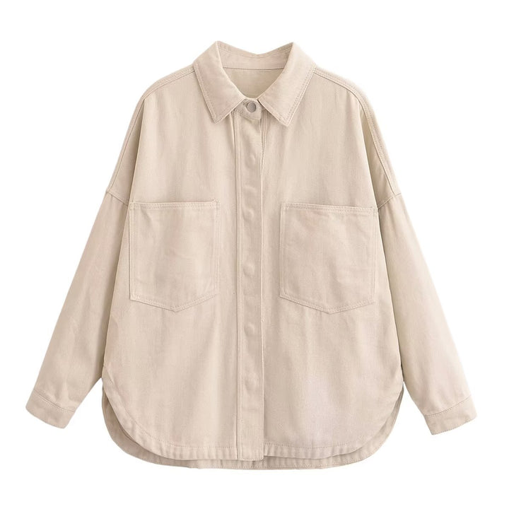 Women's oversized denim shirt with patch chest pockets, lightweight cotton denim, and rounded hem Mune Fashion