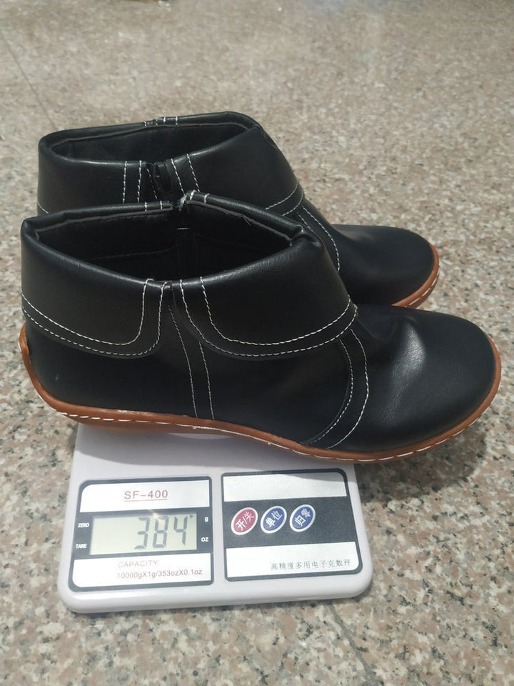 Women's soft leather booties with foldable strap, side zipper and flexible tread sole Mune Fashion