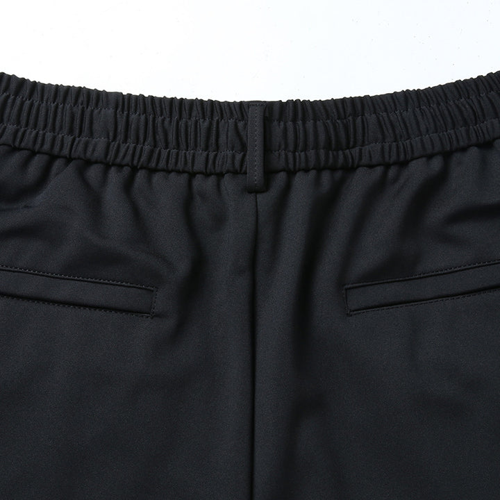 Men's leisure pants with elastic waistband, tapered cut and zippered pockets Mune Fashion
