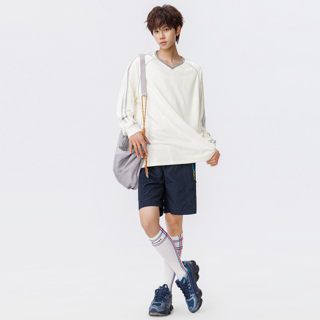 Damen Weites V-Ausschnitt Oversize-Sportshirt mit Raglanärmeln und Kontraststreifen Mune Fashion