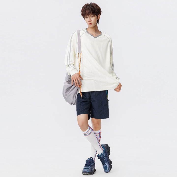 Damen Weites V-Ausschnitt Oversize-Sportshirt mit Raglanärmeln und Kontraststreifen Mune Fashion