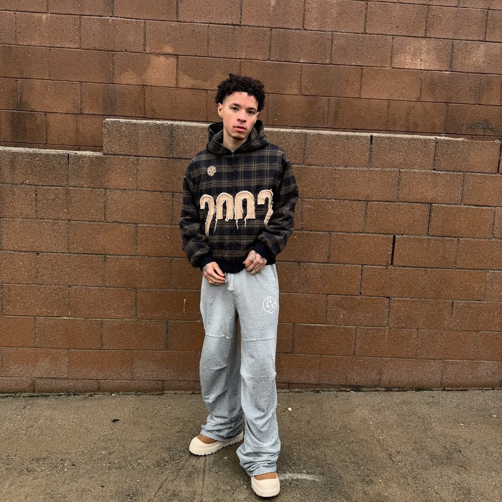 Unisex nan checkered hoodie with frayed year application and ribbed cuffs Mune Fashion