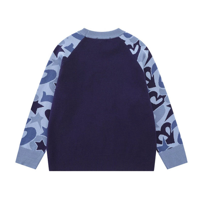 Women's knit sweater with raglan sleeves, statement jacquard sleeves, and ribbed hem Mune Fashion