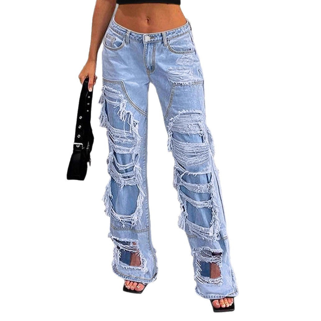 Women high-cut heavily ripped denim jeans with wide leg and decorative seam panels Mune Fashion