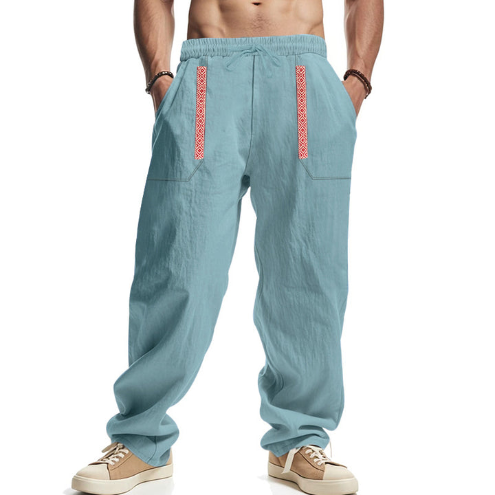 Men's loose-fitting casual pants made of linen blend with elastic waistband, deep side pockets, and ethnic decorative band Mune Fashion