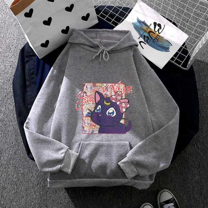 Women's oversized hoodie with shimmering anime cat motif, kangaroo pocket, and soft fleece lining Mune Fashion