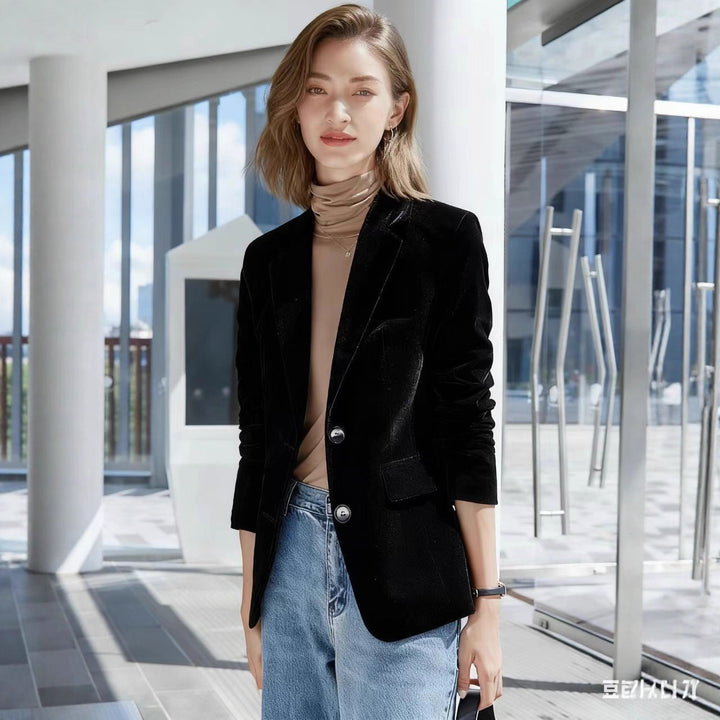 Women's narrow-cut velvet blazer with extended hem, flap pockets, and polished buttons Mune Fashion
