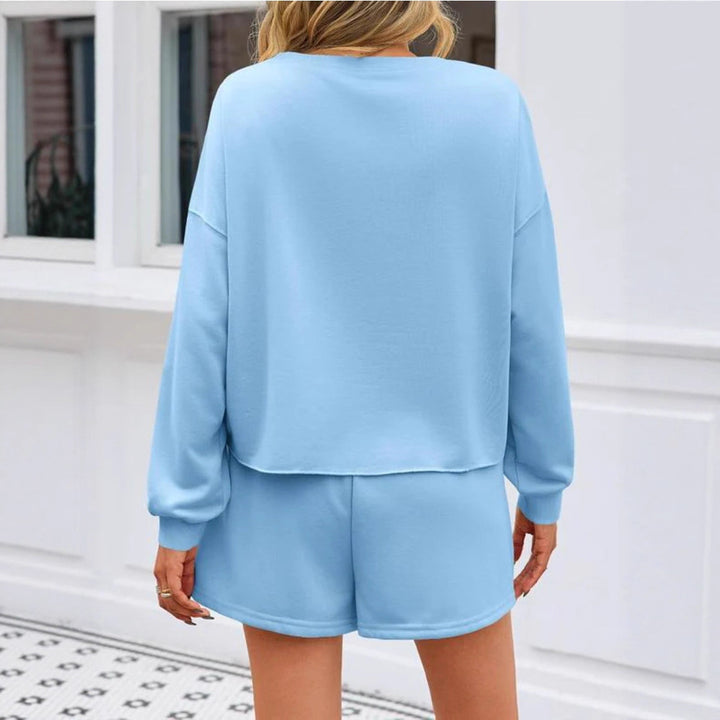 Ladies nan pearl-embellished sweat set with oversized sweater and flared mini skirt Mune Fashion