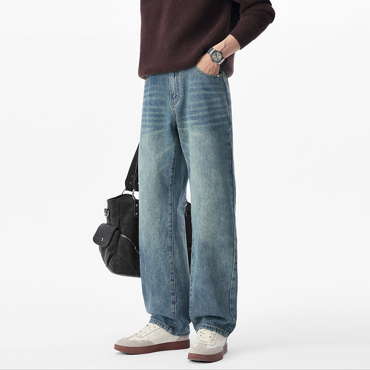 Men's baggy jeans made of heavy denim with a light used finish and a low crotch.