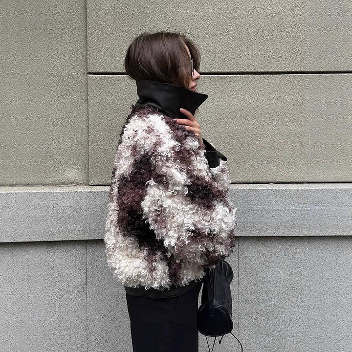 Women's short jacket made of curly bouclé faux fur with leather look detailing Mune Fashion