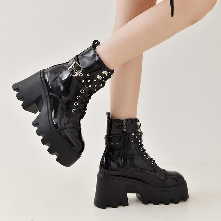 Ladies high-cut platform biker ankle boots in patent look with lacing, side zipper, and decorative buckle and stud application Mune Fashion