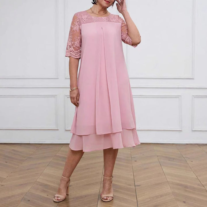 Women's A-line chiffon dress with floral embroidered lace yoke, hidden centre seam pleat, and layered ruffle Mune Fashion