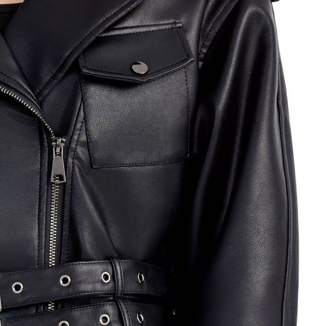Ladies short fitted biker jacket made of faux leather with double waist belt, epaulettes and zipper details Mune Fashion