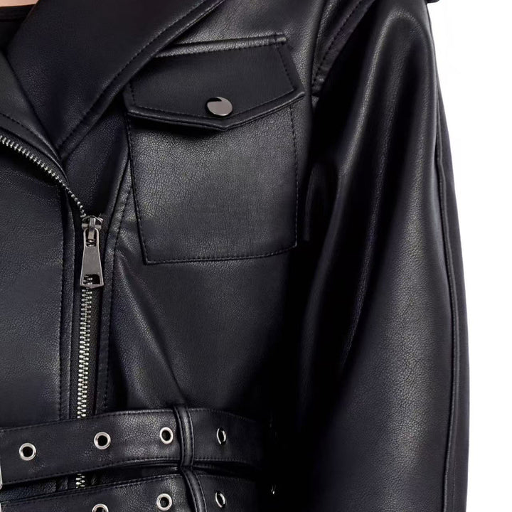 Ladies short fitted biker jacket made of faux leather with double waist belt, epaulettes and zipper details Mune Fashion