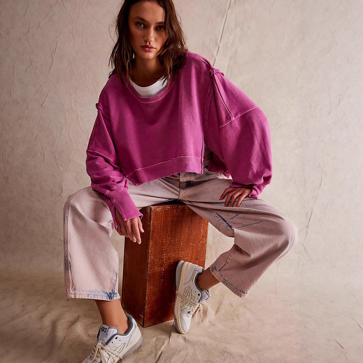 Women's cropped oversized sweatshirt with thumb hole, frayed hem, and wide raglan sleeves Mune Fashion