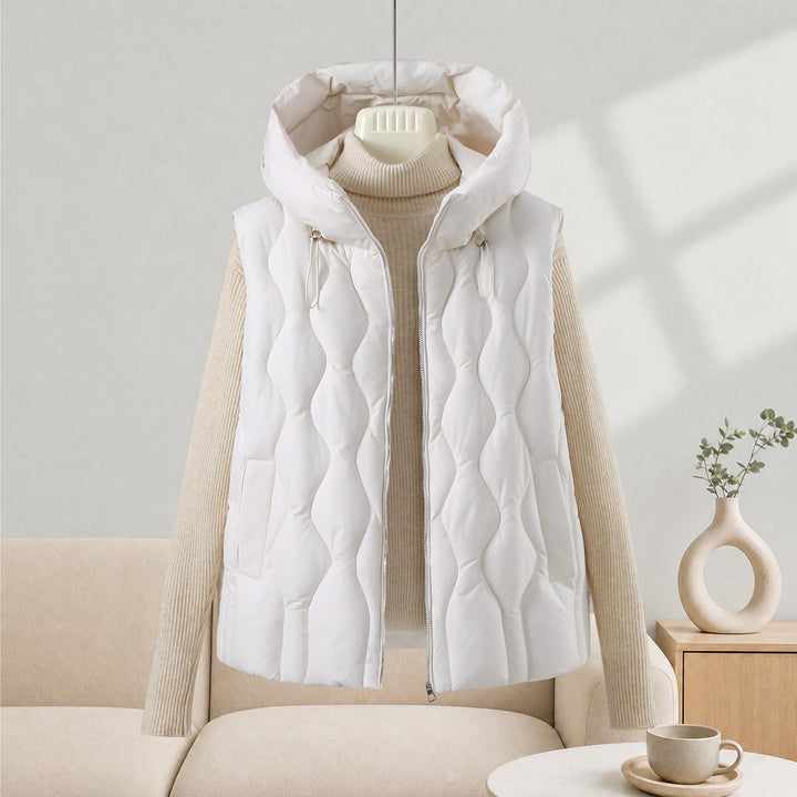 Women longer cut quilted vest with hood, wave quilting and detachable zipper Mune Fashion