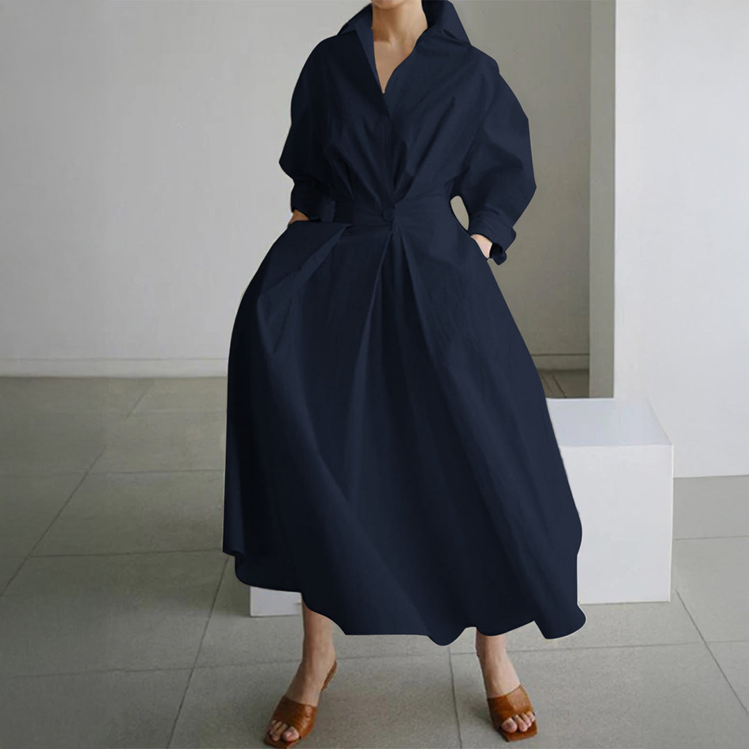 Women's tailored shirt dress with boxy collar, mid-length sleeves, side pockets, and flared pleated skirt Mune Fashion