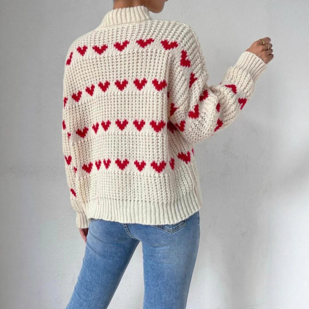 Women's chunky knit sweater with knitted heart patterns, high stand-up collar, and relaxed oversized silhouette Mune Fashion