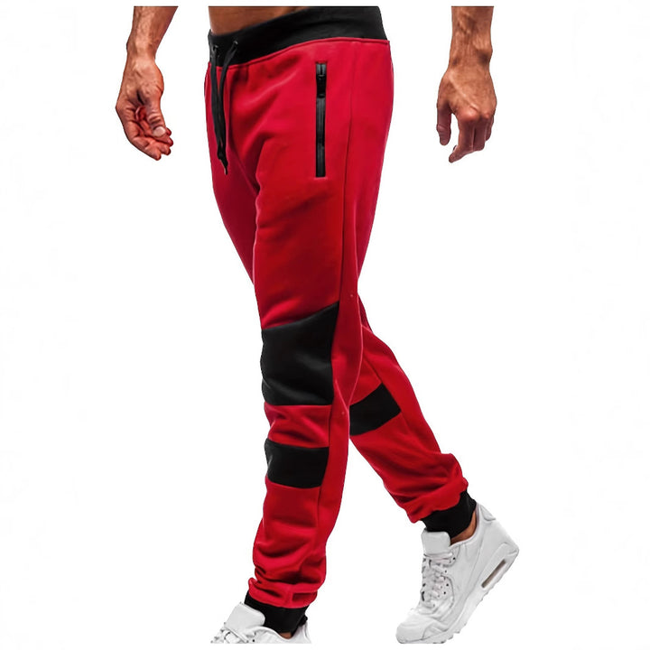 Men's slim-fit jogging pants with zip pockets, elastic comfort waistband, and reinforced knee panels Mune Fashion