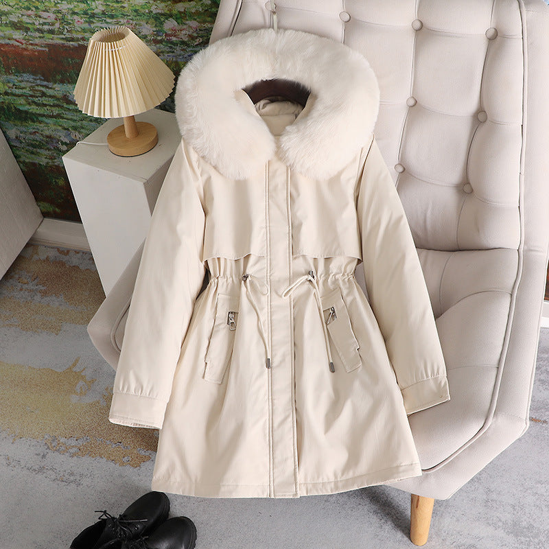 Women's mid-length water-repellent parka with voluminous faux fur collar, waistband drawstring, and multifunctional flap pockets Mune Fashion