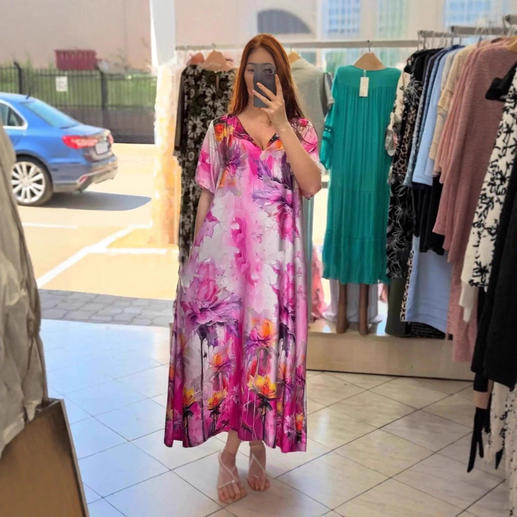 Women flowing maxi kaftan dress with V-neck and large watercolor floral print Mune Fashion