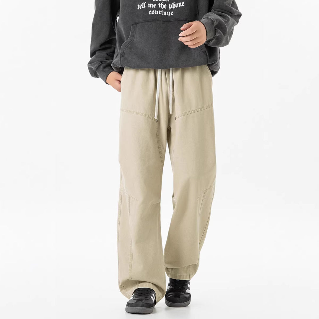 Men's wide baggy cargo pants made of washed canvas with elastic waistband and decorative stitching panels Drune