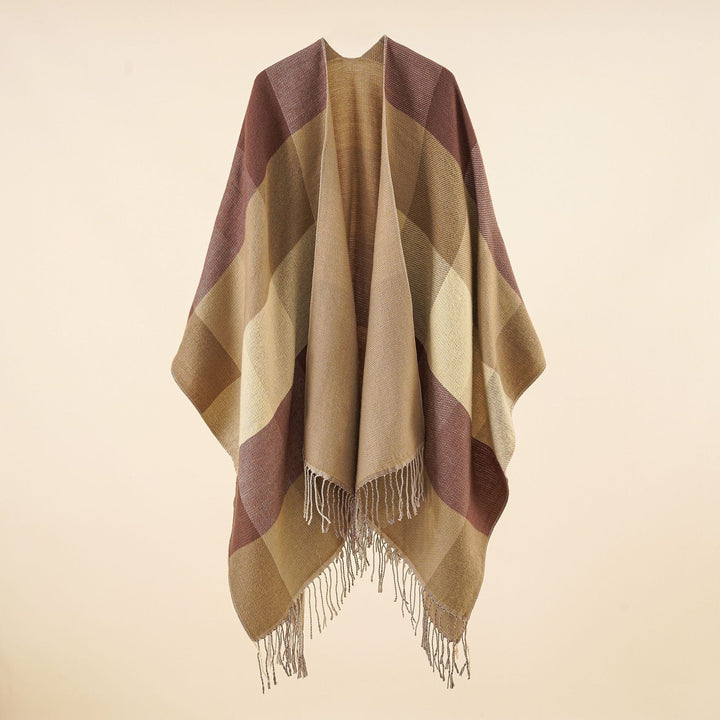 Women’s web cape in a boxy ruana cut with diagonal check pattern and fringes