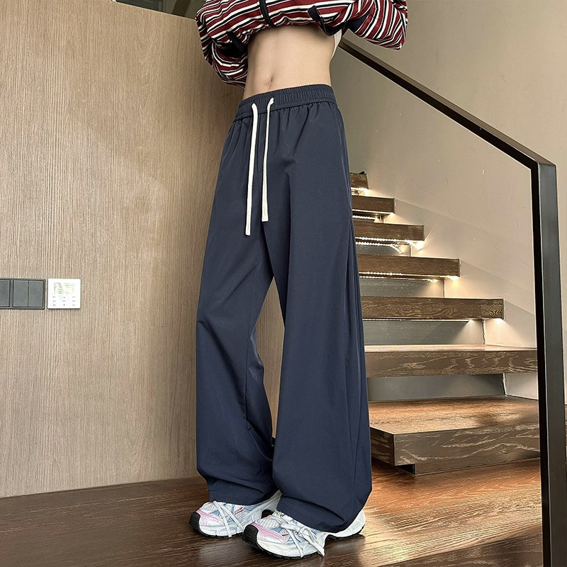 Women's wide-cut lounge pants with high elastic waistband and drawstring Mune Fashion