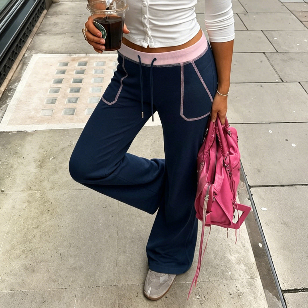 Women nan flared sweatpants with high waistband, drawstring, and contrasting decorative seams Mune Fashion