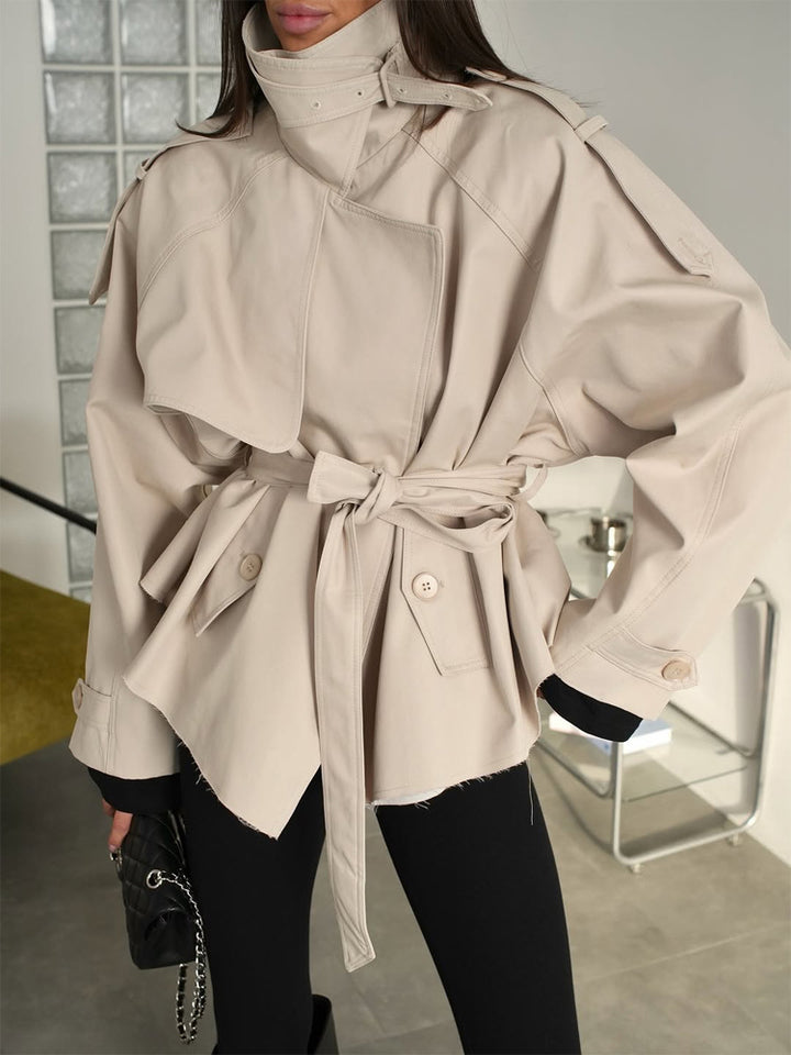 Women's short trench coat with wide standing collar, shoulder epaulettes, and waist belt Mune Fashion
