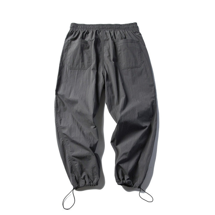 Unisex Technical Cargo Pants in Baggy Cut with Drawstring Waist and Adjustable Leg Closures Mune Fashion