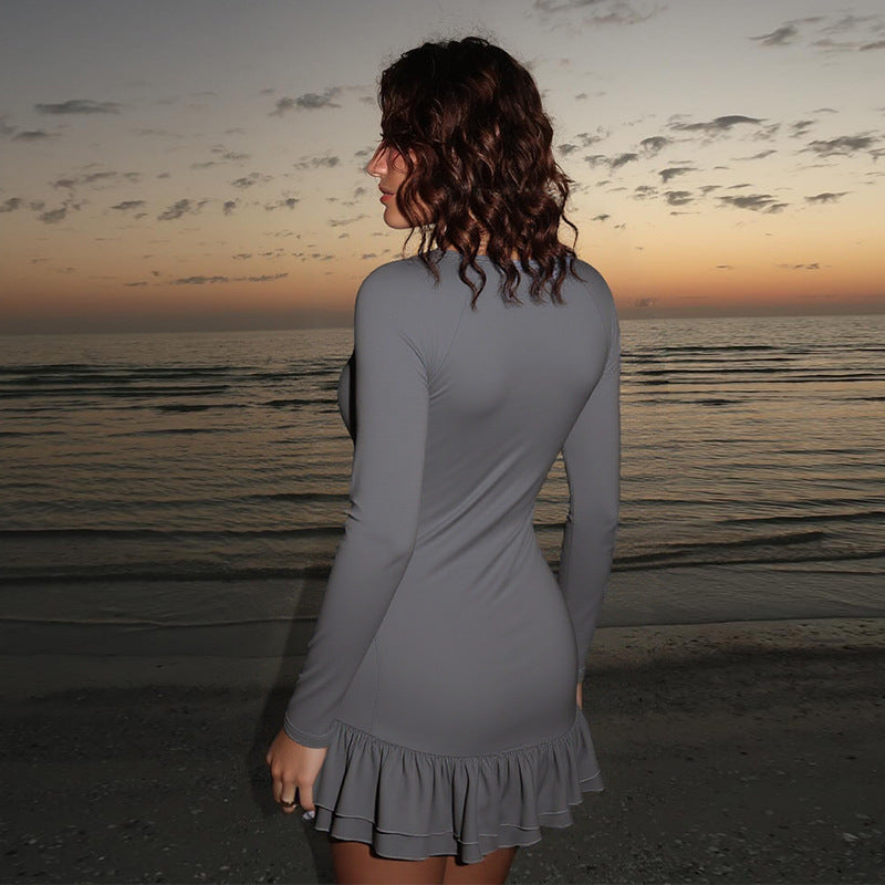 Women's figure-hugging long sleeve mini dress with deep V-neckline, sequin appliqué and ruffle hem Mune Fashion