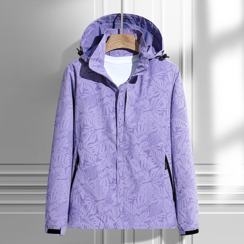 Women's lightweight packable rain and wind jacket with hood, leaf pattern and concealed zippers Mune Fashion