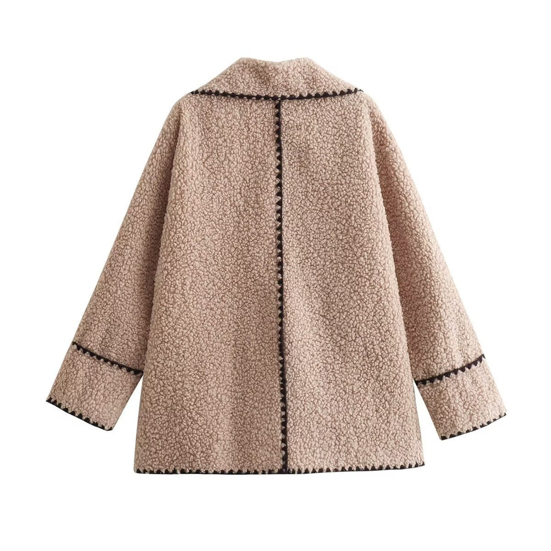 Women’s short cut teddy coat with large shawl collar, patch pockets, and contrasting decorative trim Mune Fashion